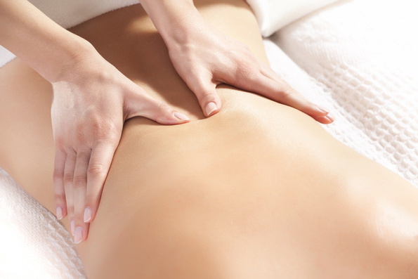 Woman Giving Back Massage to a Girl